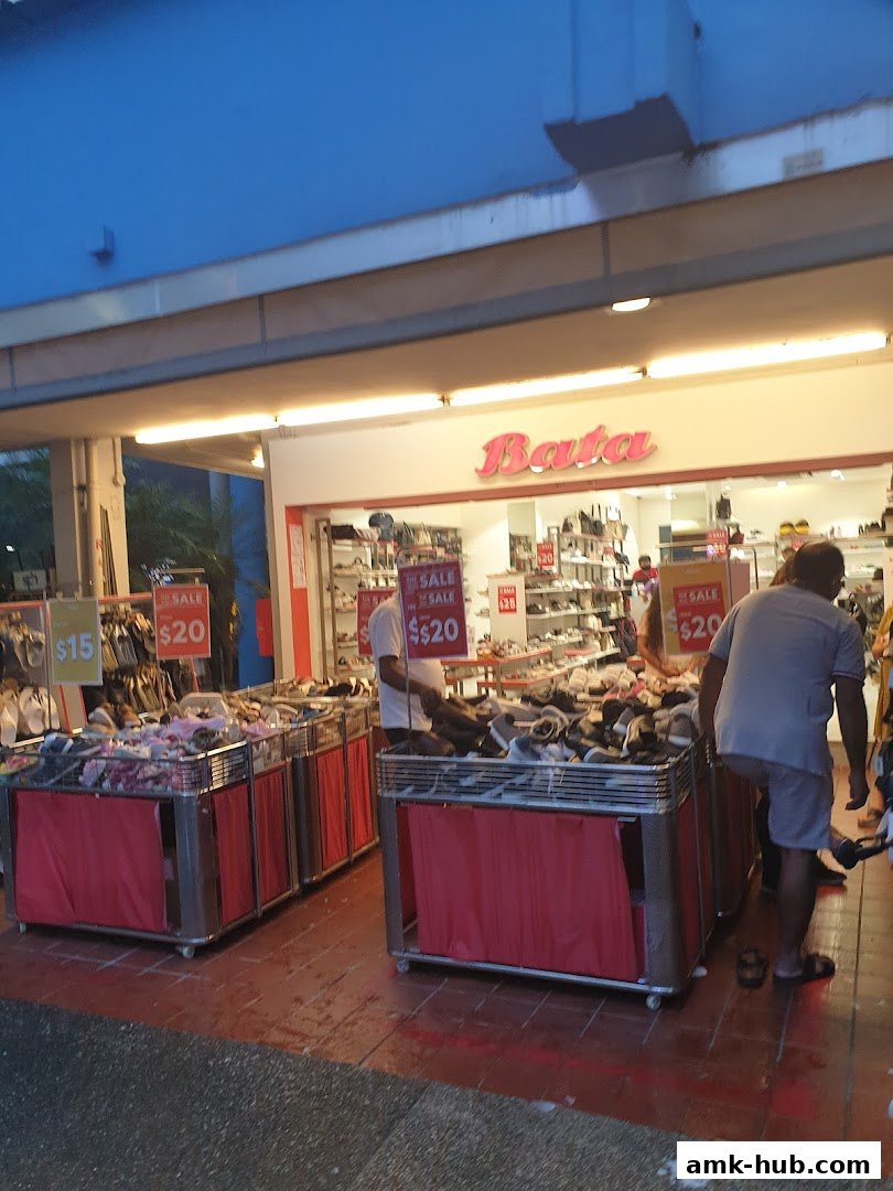 Bata shoe store with a sale on shoes displayed outside.