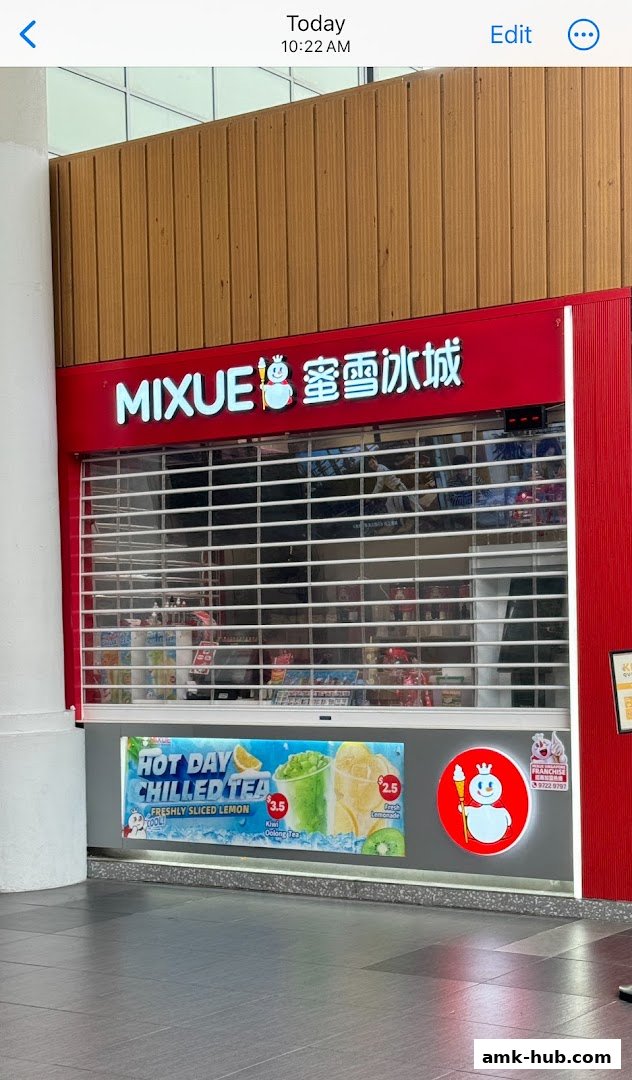 The MIXUE shop front with its signature red and white branding and a closed roller shutter.