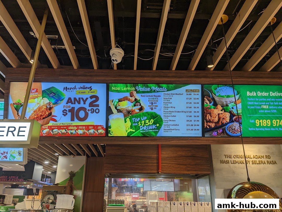 A digital menu board displaying Nasi Lemak value meals, promotions, and delivery information.