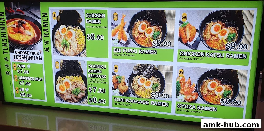 A brightly lit menu board showcasing various ramen dishes and customizable Tenshinhan options.
