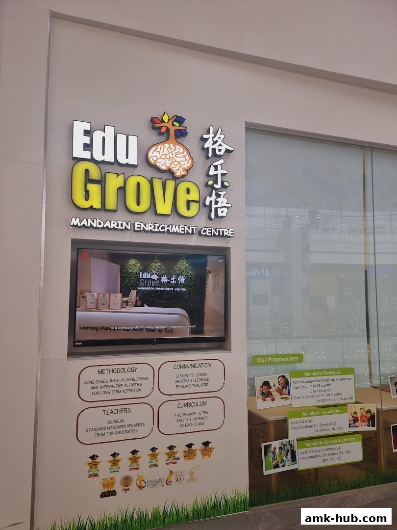 The EduGrove Mandarin Enrichment Centre sign and program details displayed on a wall.