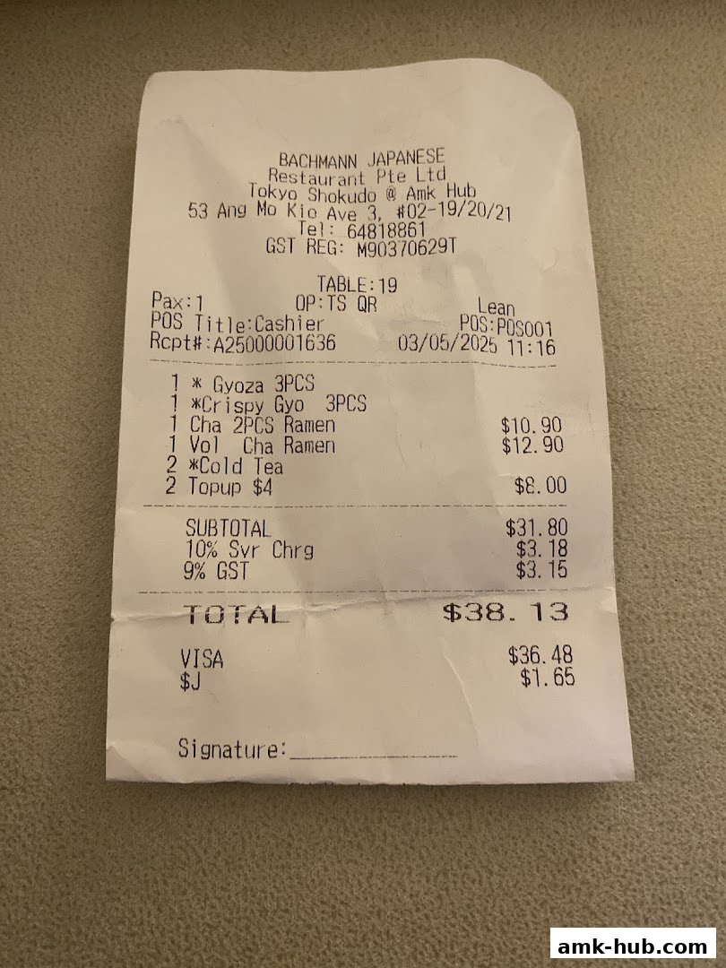 A receipt from Tokyo Shokudo showing food items and their prices.