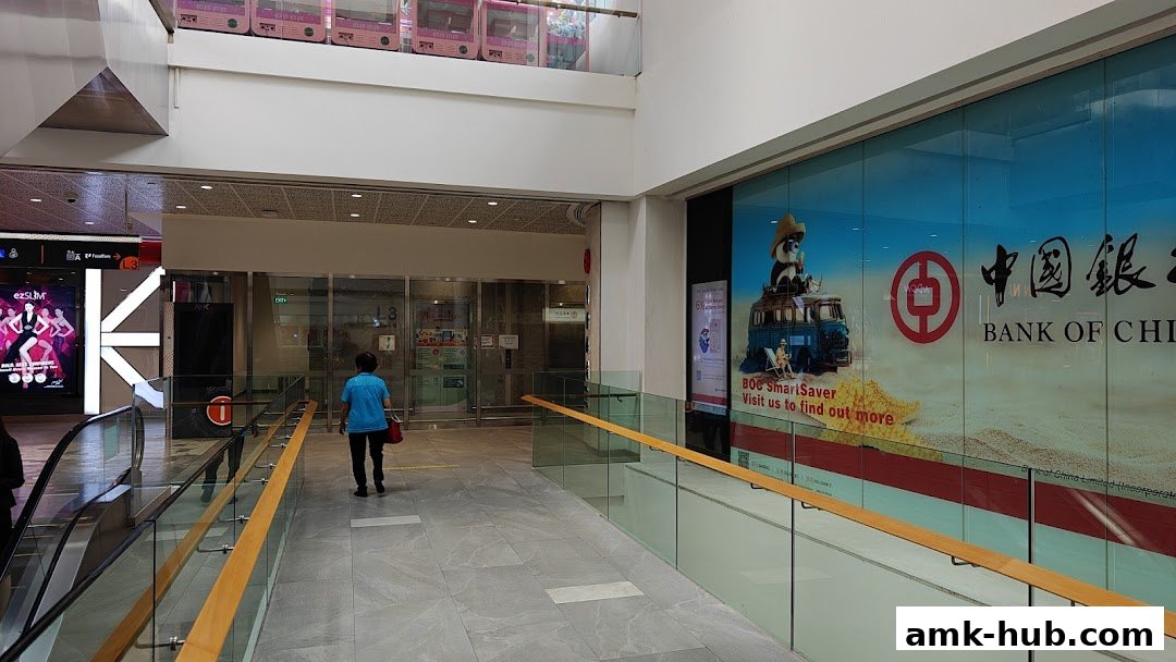 The Bank of China Ang Mo Kio Sub-Branch storefront with a large promotional graphic.
