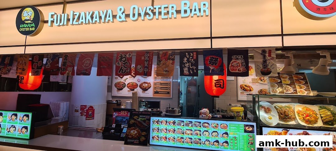 Fuji Izakaya & Oyster Bar storefront with Japanese banners and illuminated menu displays.