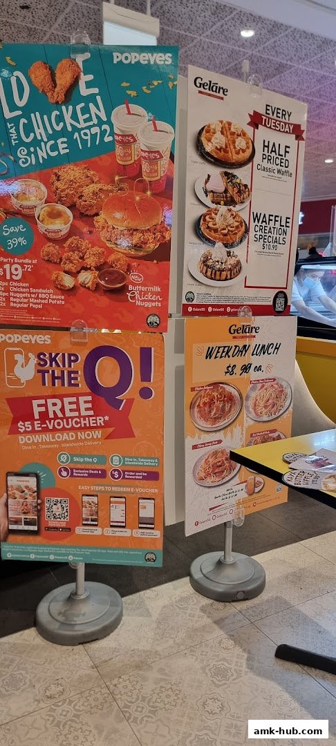 Promotional posters for Popeyes chicken and Gelare waffles and lunch specials.