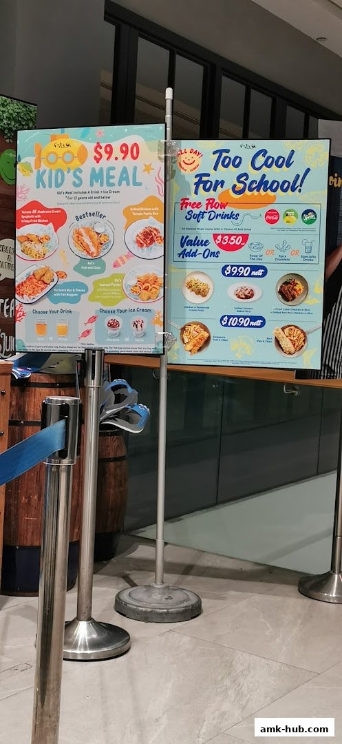 A menu board displays kid's meals and special offers with food images and prices.