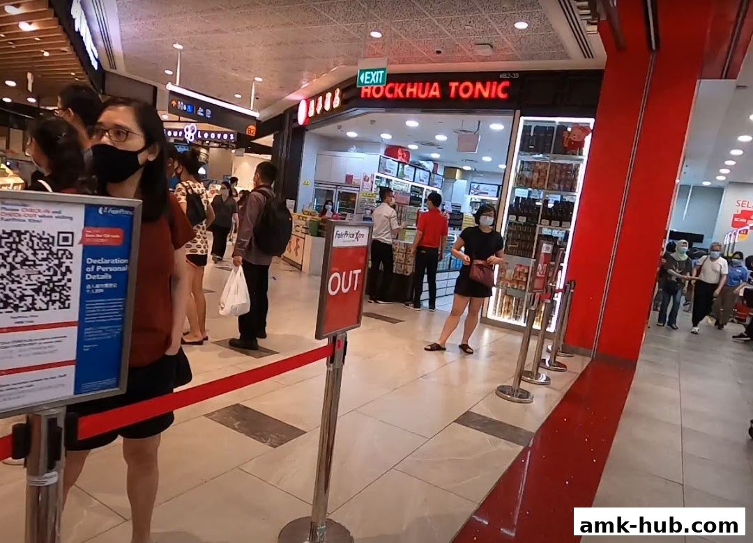 People queuing outside Hockhua Tonic, a shop selling health products, in a mall.
