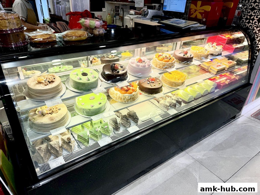 A display case filled with various cakes and pastries at Bengawan Solo.