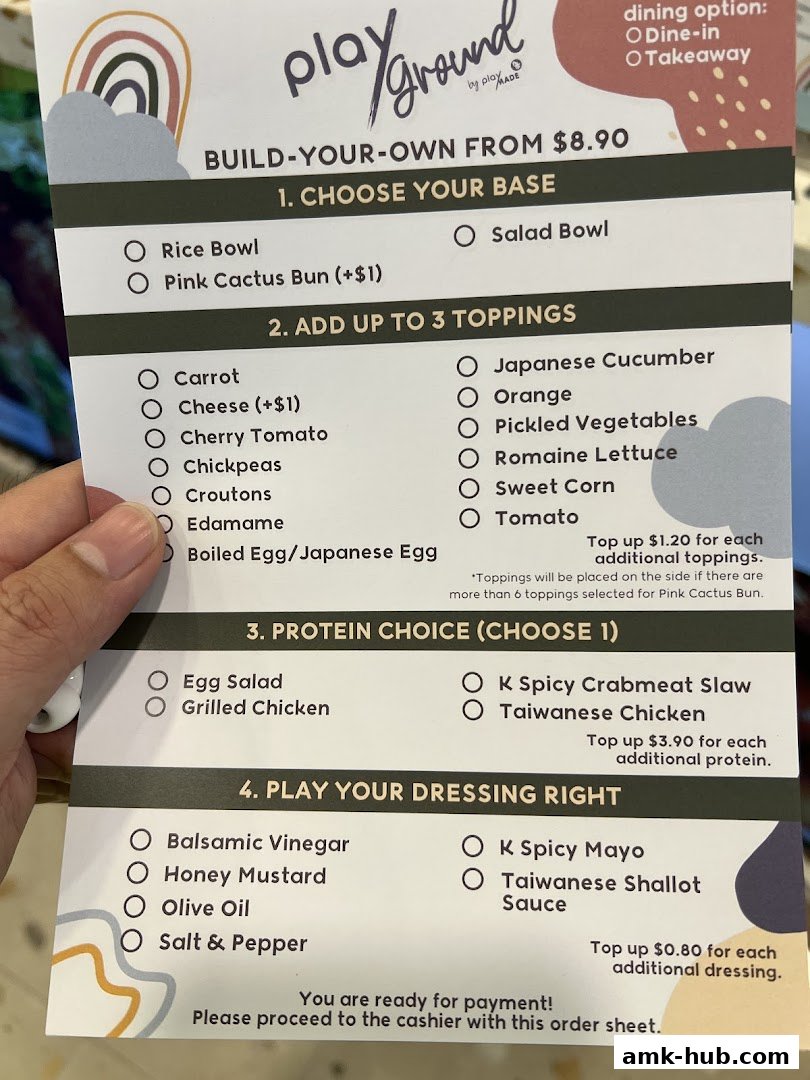 A build-your-own menu from Playground by PlayMade, detailing bases, toppings, protein, and dressings.
