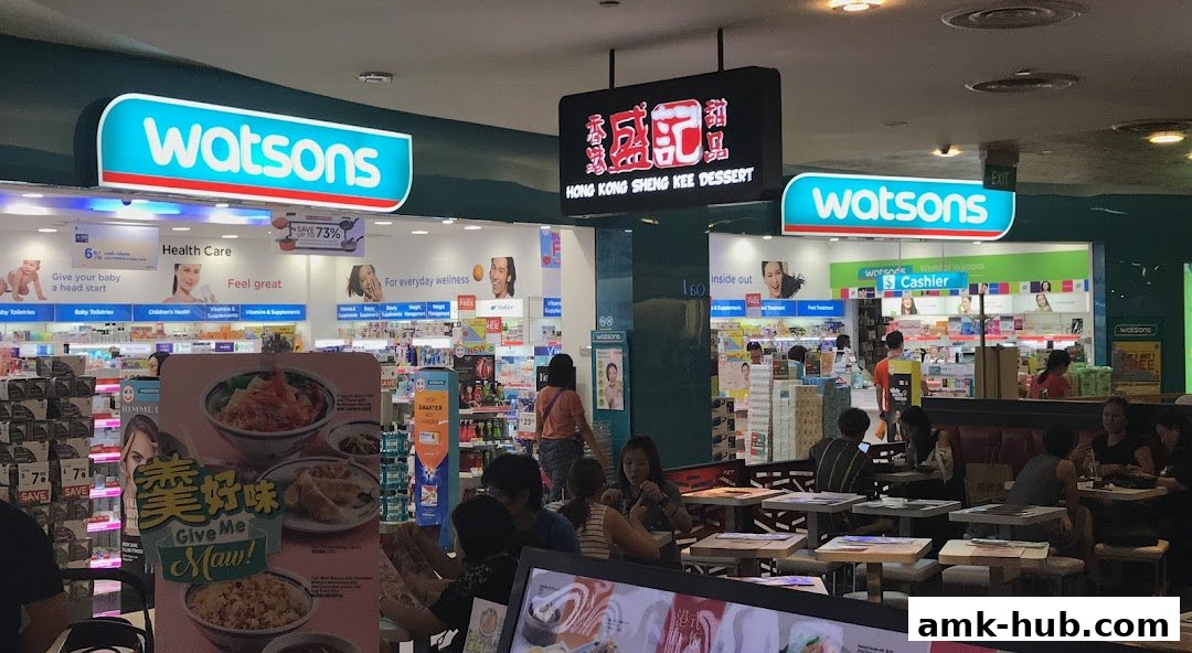 A Watsons store with a Hong Kong Sheng Kee Dessert stall and seating area.