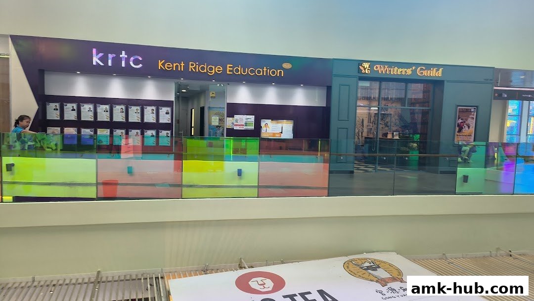 The KRTC Kent Ridge Education shop front with a neighboring Writers' Guild shop.