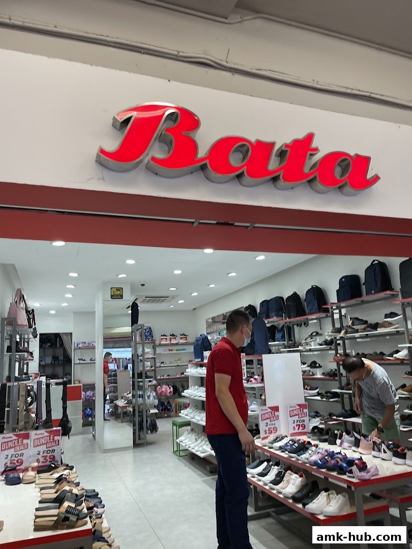 The Bata shoe store interior with various footwear displayed and customers browsing.