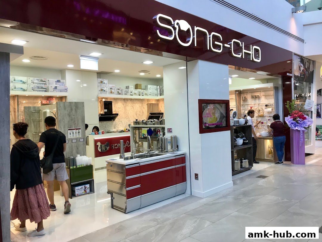 The exterior of the Song-Cho kitchenware store with products displayed inside.