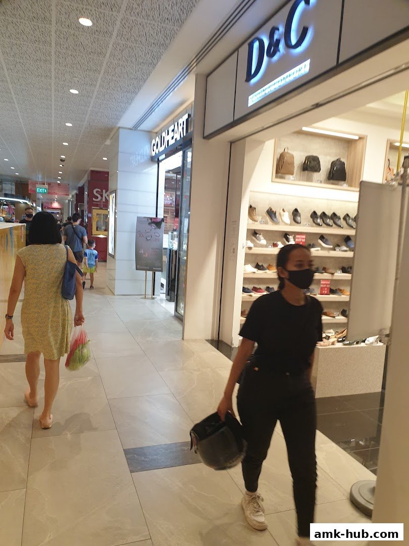 A view of the D&C shoe store entrance with shoes displayed inside.