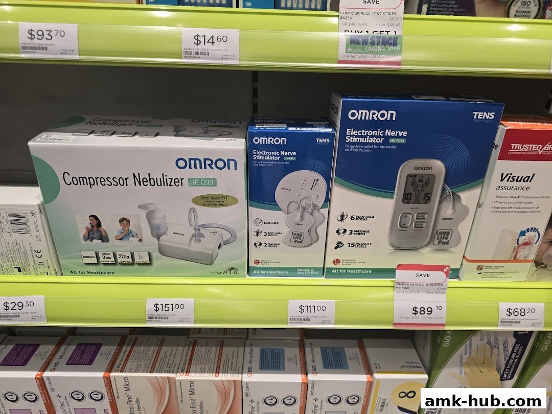Shelves stocked with OMRON health devices like nebulizers and nerve stimulators, with prices displayed.