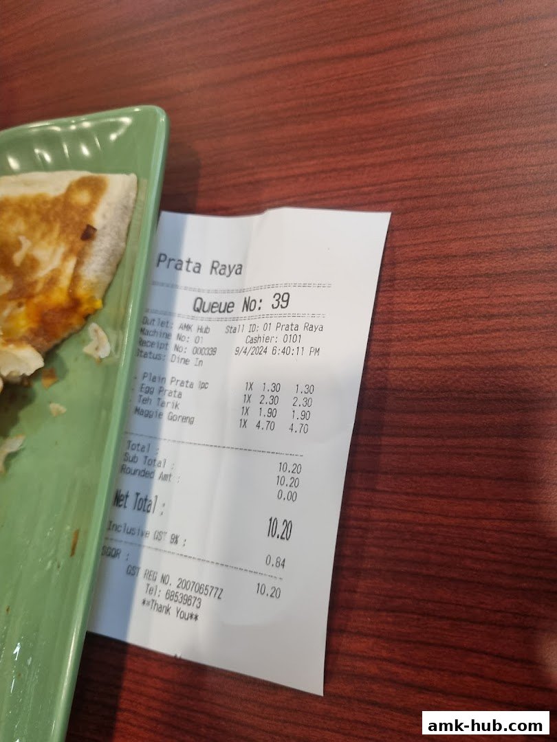 A receipt from Prata Raya showing a queue number and purchased items.