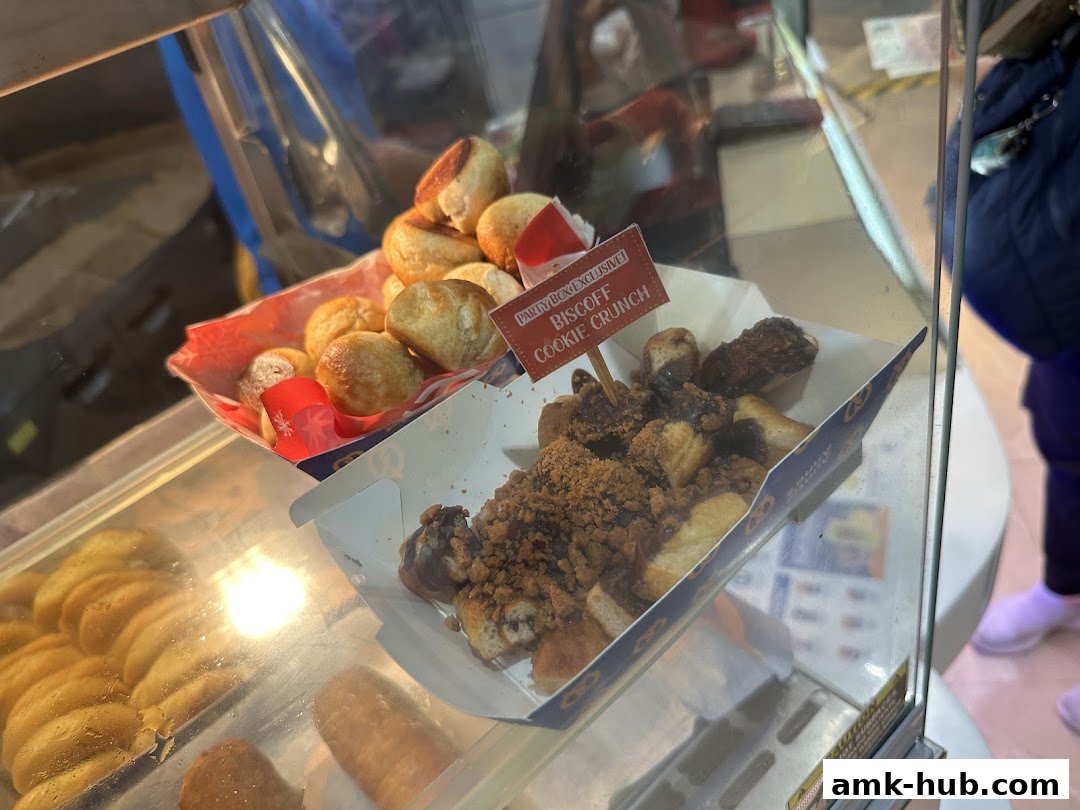 A display case filled with freshly baked pretzels and a special Biscoff Cookie Crunch pretzel.