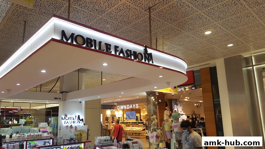 The entrance to Mobile Fashion, a retail store with clothing displays and accessories.