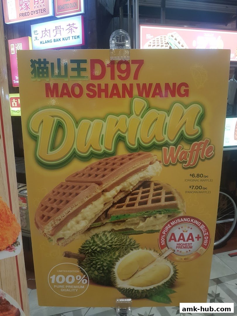 A sign advertising Mao Shan Wang Durian Waffles with prices and descriptions.