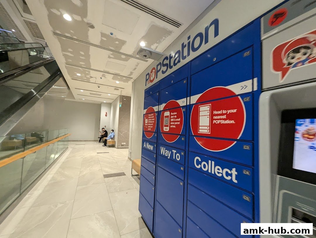 POPStation parcel lockers in a mall hallway with escalators and seating.