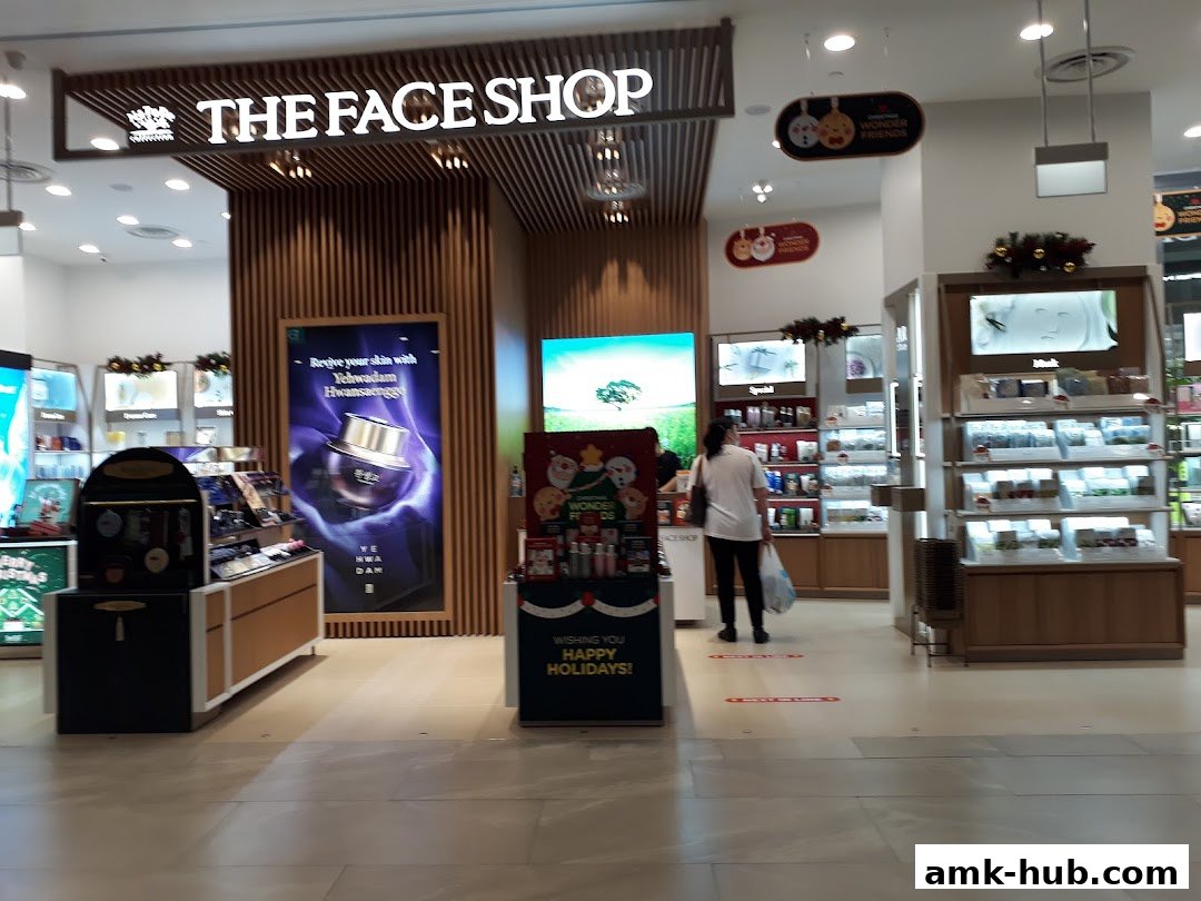 The entrance of THEFACESHOP, showcasing skincare products and holiday decorations.