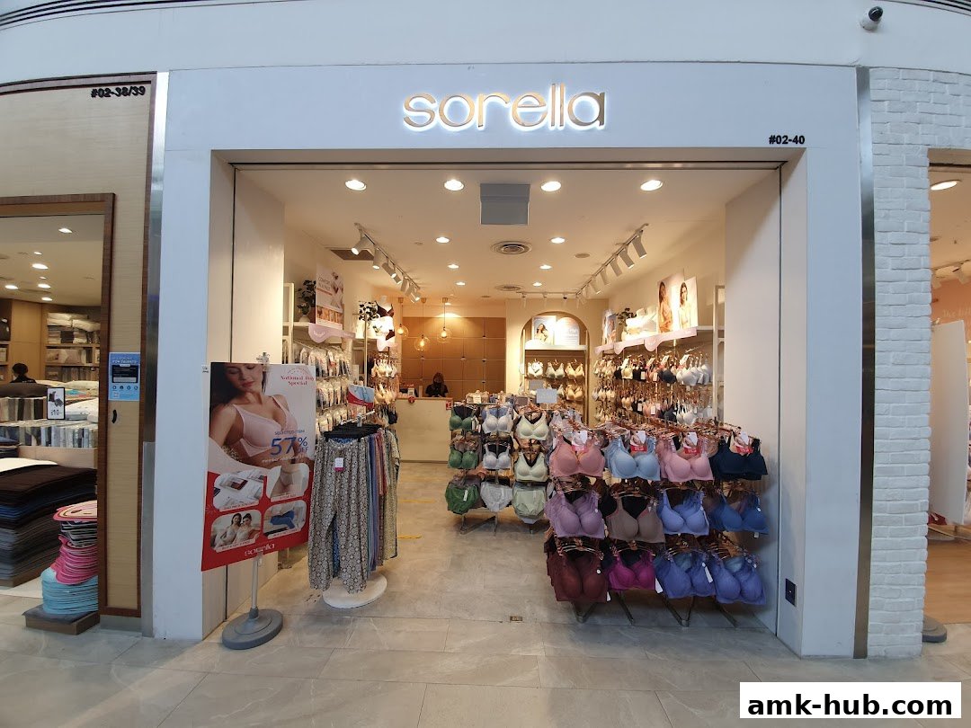 The entrance of a Sorella lingerie shop displaying various bras and promotional materials.