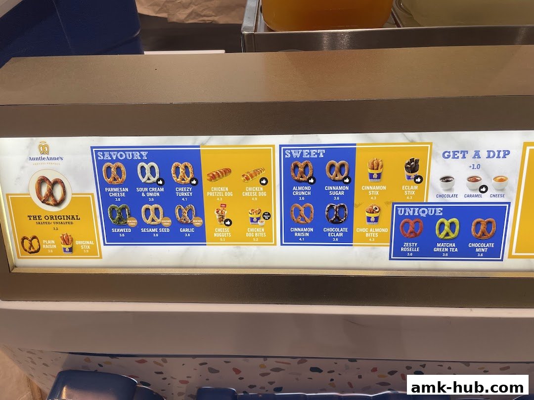 A menu board displaying various savory, sweet, and unique pretzel flavors from Auntie Anne's.