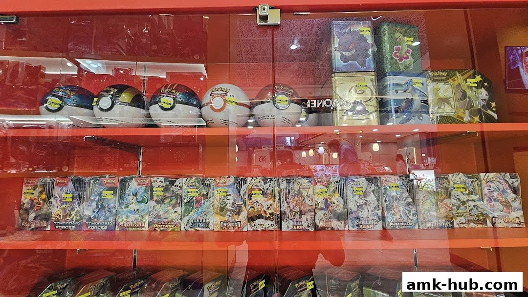 Shelves stocked with Pokemon trading cards, booster packs, and collectible tins.