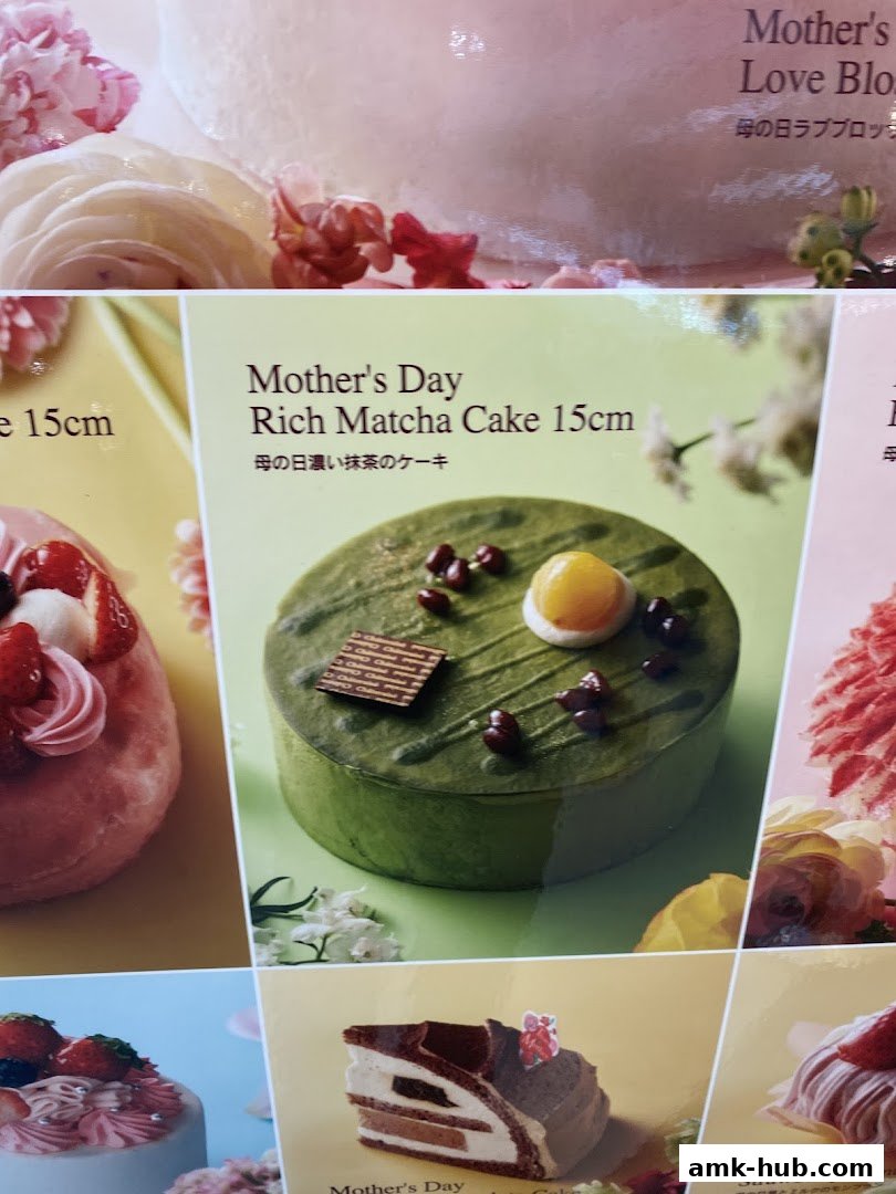 A display of various cakes, including a matcha cake and strawberry cake, for Mother's Day.