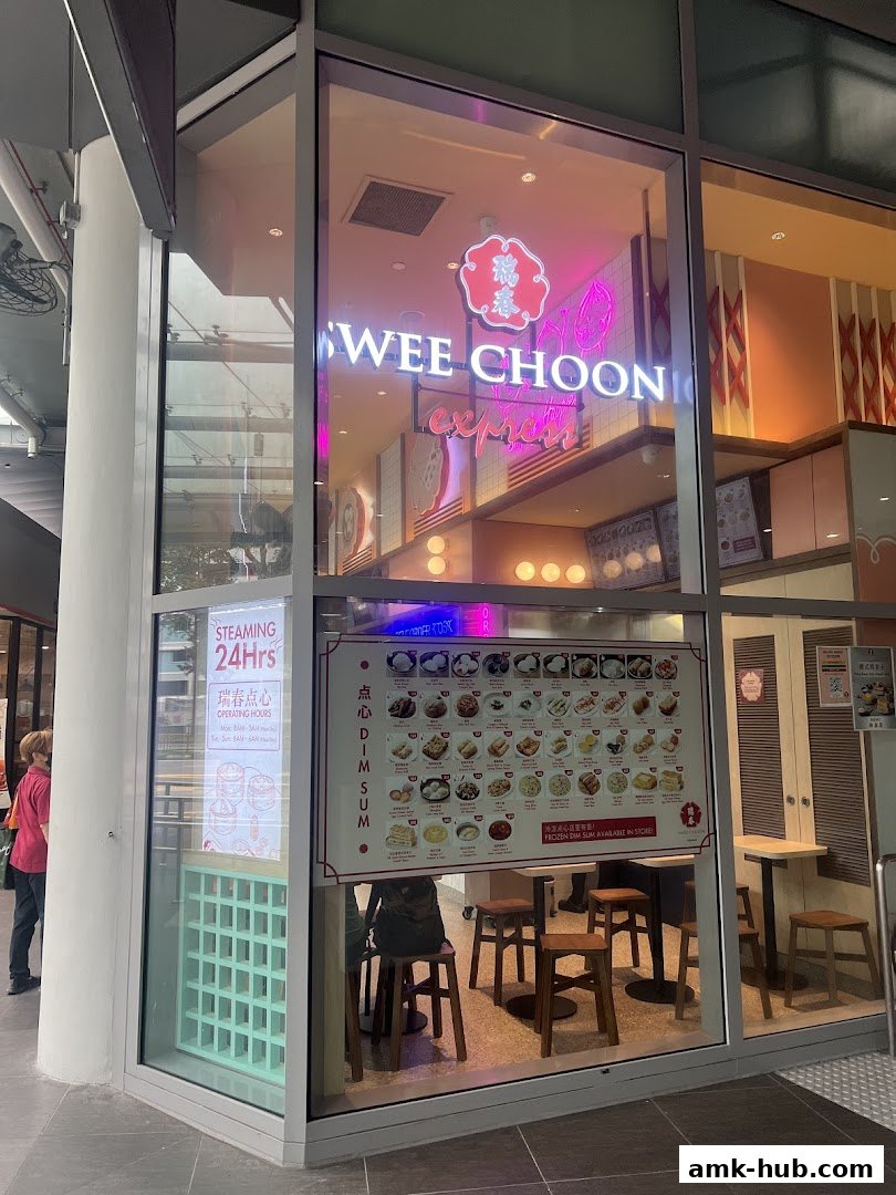 The exterior of Swee Choon Tim Sum Restaurant Express with a visible menu and seating.