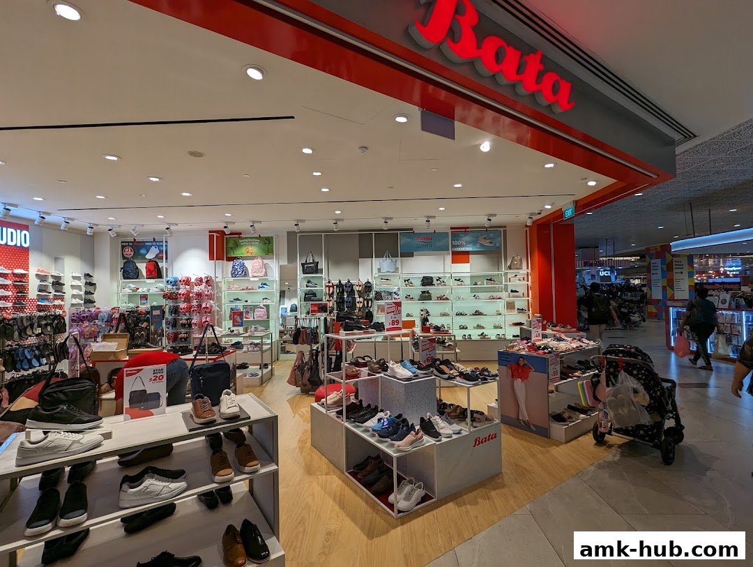 Interior view of a Bata shoe store showcasing a wide variety of footwear and bags.
