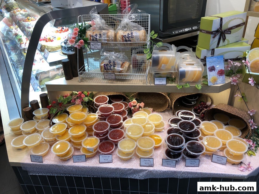 A display of assorted fruit jellies and pastries in a Châteraisé shop.