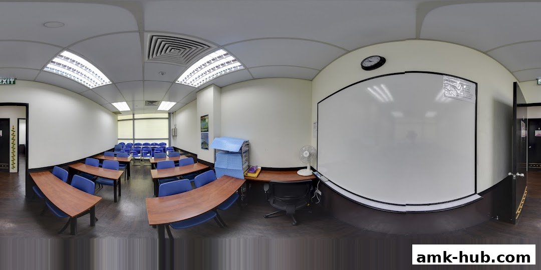 A classroom setup with desks, chairs, and a whiteboard, ready for learning.