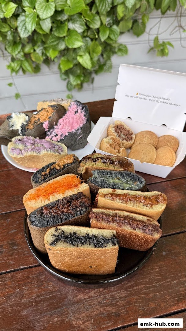 A variety of colorful and filled pancakes are displayed on a wooden table.