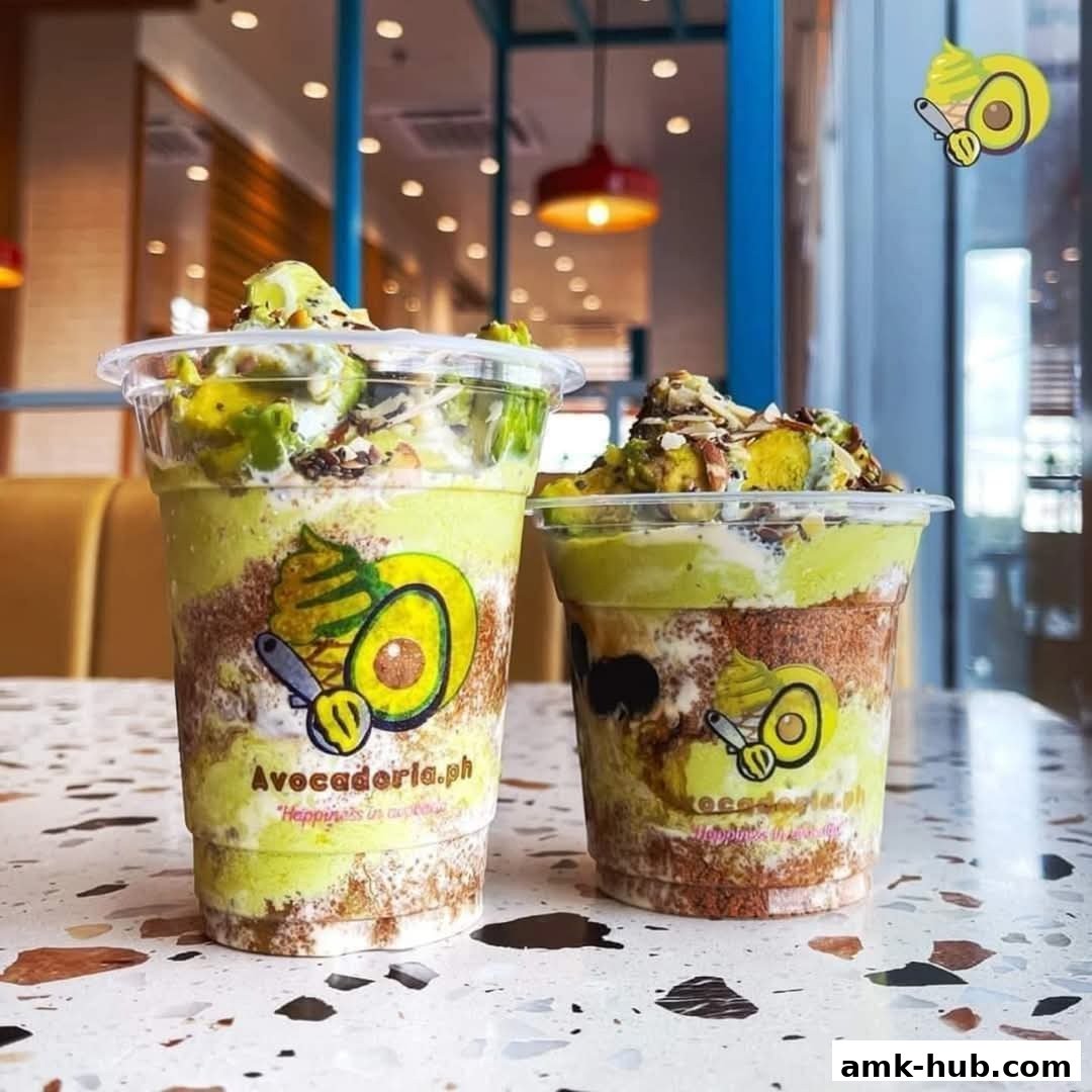 Two delicious avocado desserts in clear cups, topped with fresh avocado and nuts.