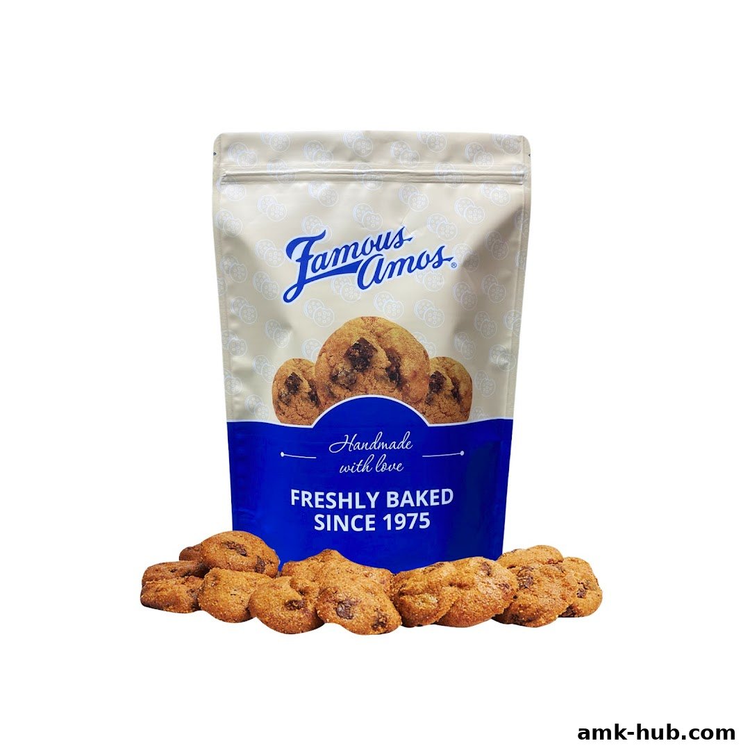 A bag of Famous Amos chocolate chip cookies with cookies scattered in front.