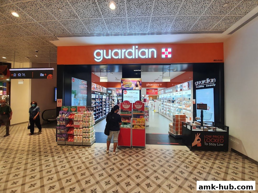 The Guardian Health & Beauty Pharmacy store front with products displayed inside and outside.