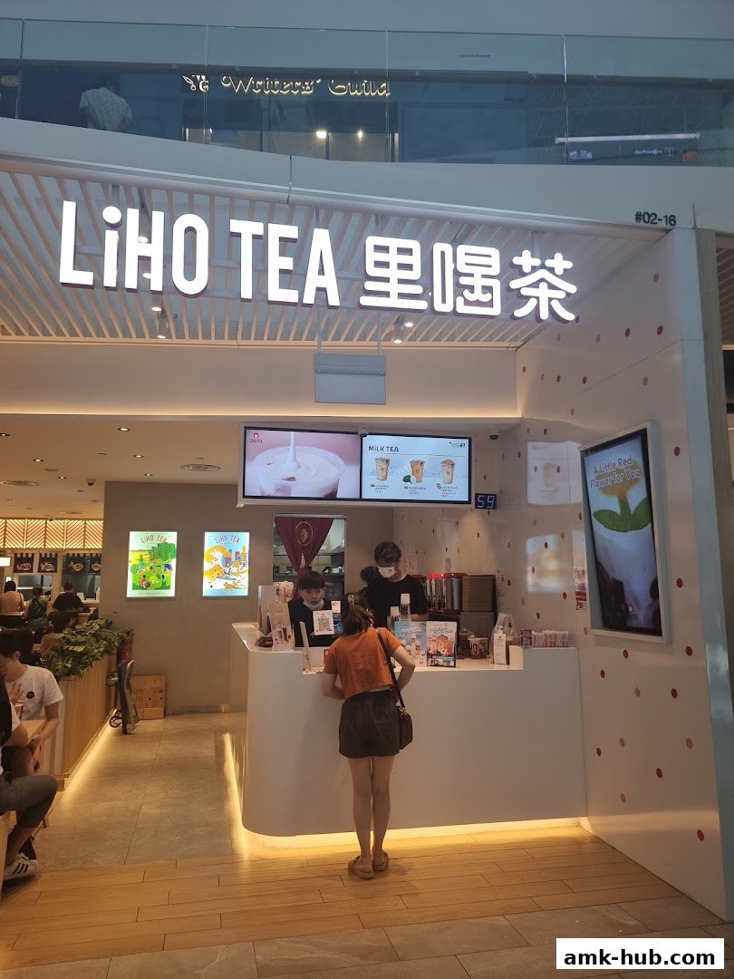 A LiHO TEA shop with staff serving customers at the counter.
