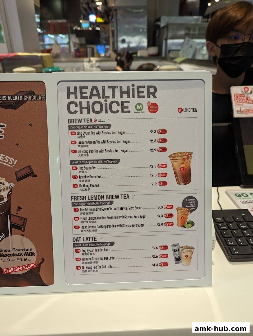 A menu board for LiHO TEA featuring healthier choices like Brew Tea, Fresh Lemon Brew Tea, and Oat Latte.
