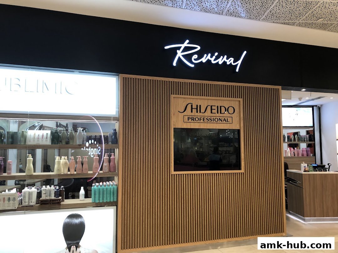 The Revival Hair Gallery shop front features a modern design with wooden accents and displays of hair products.