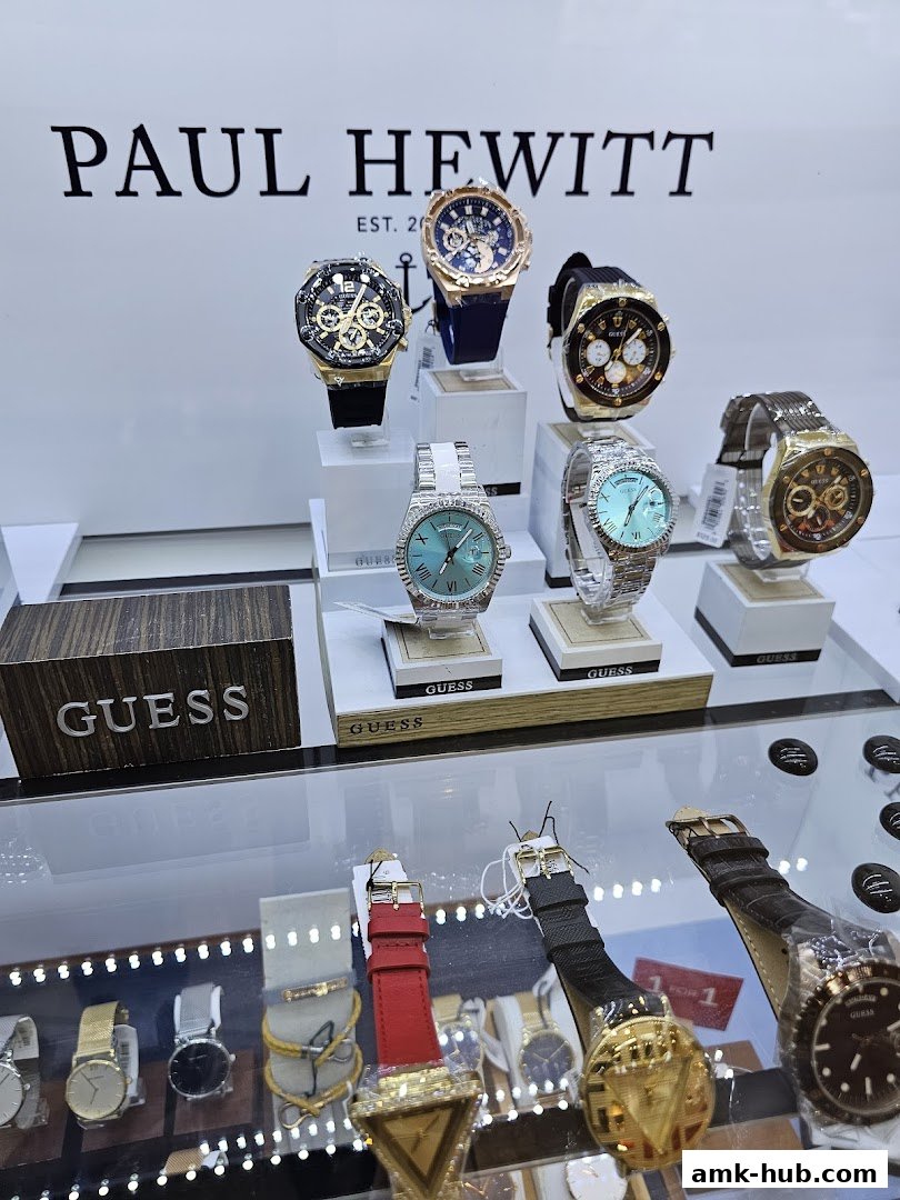 A display of various stylish watches from Paul Hewitt and Guess brands.