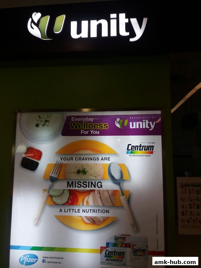 A Unity shop front with a large advertisement for Centrum vitamins.