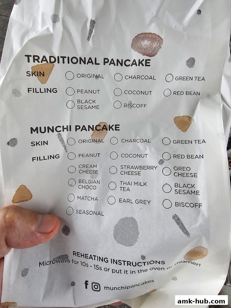 A menu for Munchi Pancakes showing traditional and Munchi pancake options with various skin and filling choices.