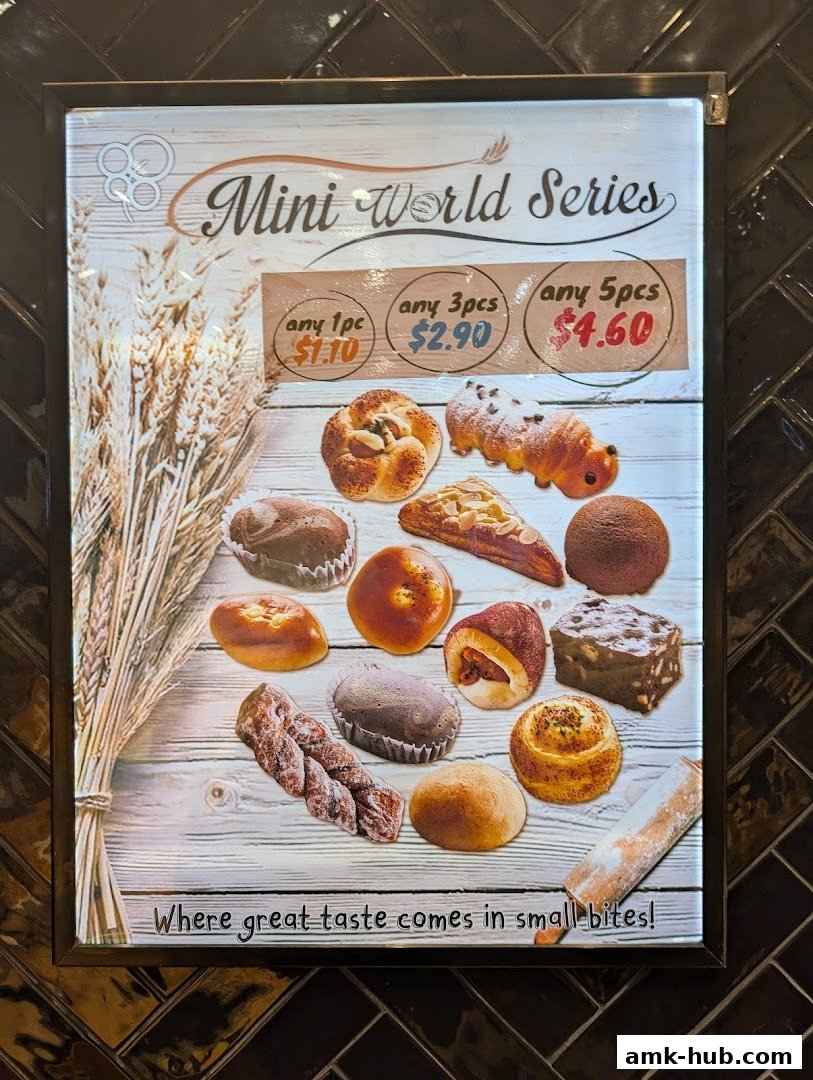 A menu board showcasing a variety of mini pastries and baked goods with pricing.