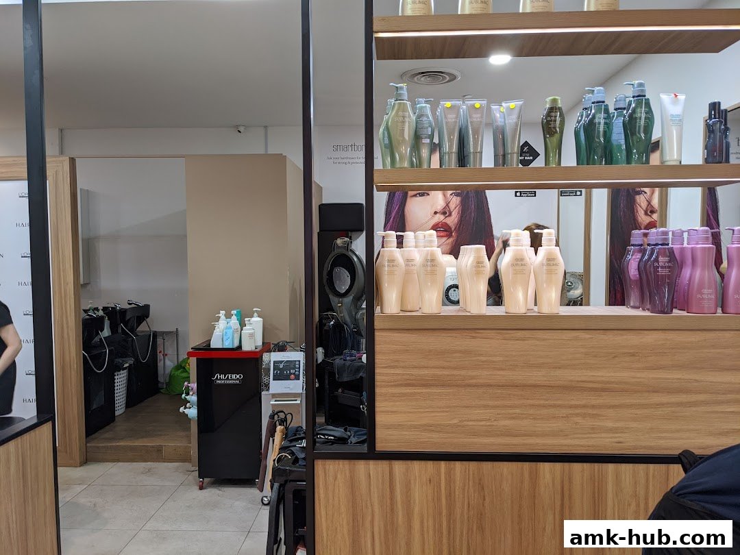 Interior view of a hair salon with shelves of hair products and styling stations.