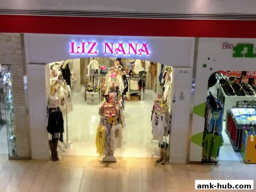 The entrance of Liz Nana, a boutique store, showcasing fashionable clothing on mannequins and racks.