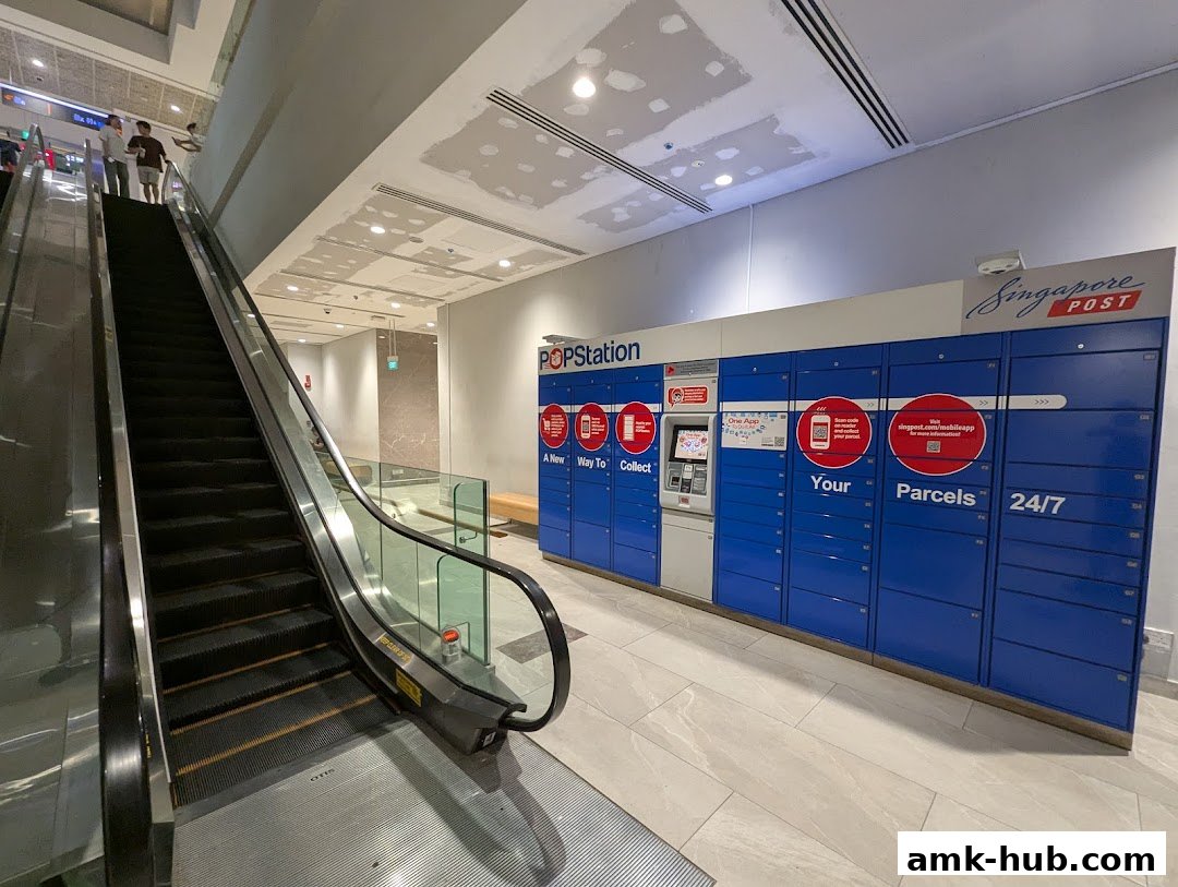 POPStation parcel lockers and an escalator in a modern shopping mall.