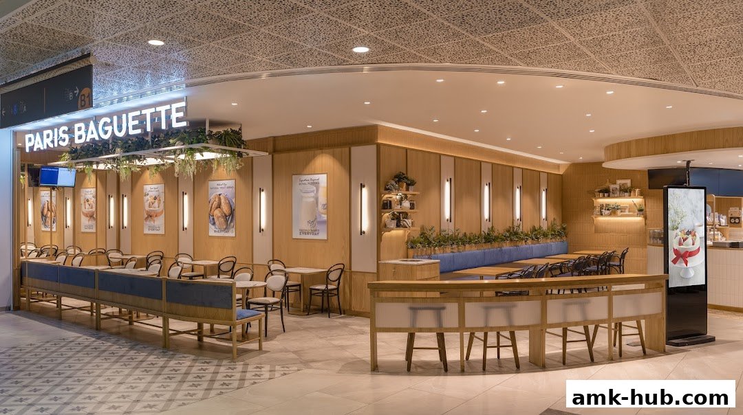 Interior view of Paris Baguette AMK Hub, showcasing seating and decor.
