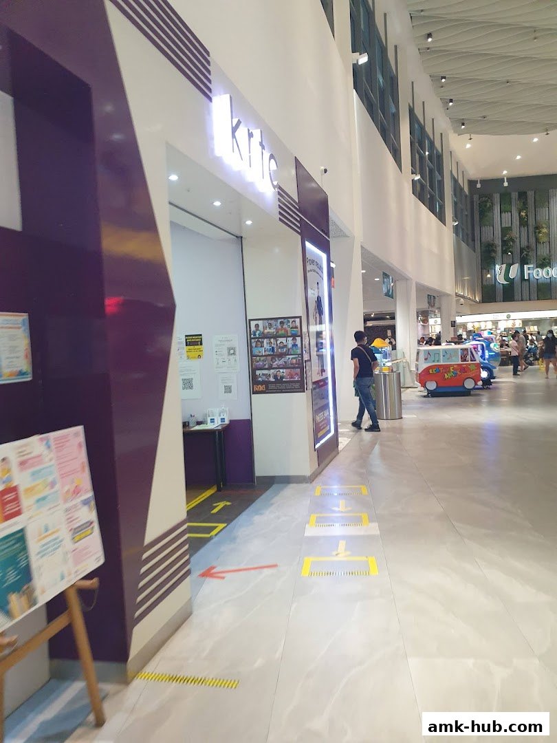 The entrance of the KRTC Ang Mo Kio shop with social distancing markers on the floor.