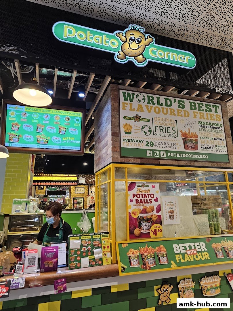 Potato Corner shop front with a menu board, staff member, and promotional displays.